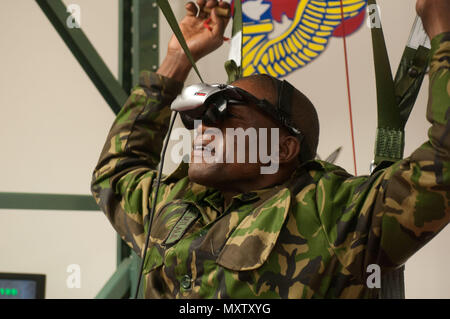 Sgt. Lentikile Dittale representing the Botswana Special Forces Regiment prepares to use the U.S. steering parachute simulator to familiarize himself before participating Operation Toy Drop XIX. Operation Toy Drop is an annual collective training exercise used to prepare Soldiers to support the Global Combatant Commanders and Army Service Component Commanders in theaters of operation around the world. (U.S. Army Reserve Photo by Spc. Tynisha L. Daniel) Stock Photo