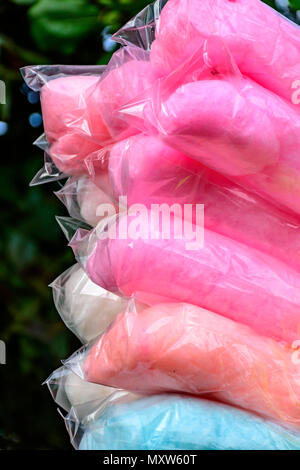 Bags with cotton candy of various colors during an afternoon in the park Stock Photo