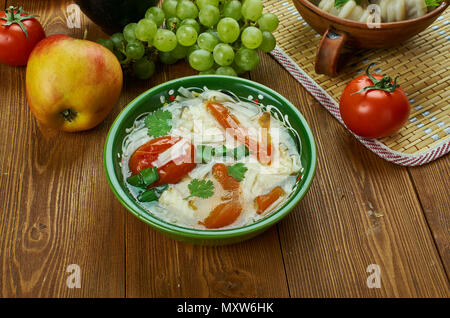 shorba Fish ogurdzhalinskaya,  Turkmen cuisine , Traditional assorted dishes, Top view. Stock Photo