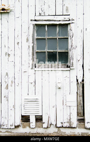 An old milk barn in northern Illinois. Since the dairy farm shut donw the buildings have been vacant. Stock Photo