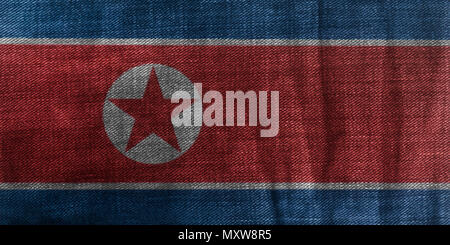 North Korea Flag On Jeans Denim Texture Background close up. Stock Photo