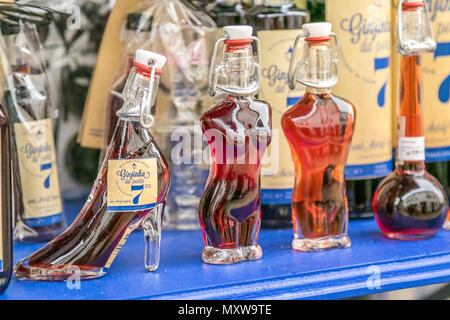 Ginja - famous Portuguese cherry liqueur - for sale on the streets of Obidos, Portugal. Stock Photo