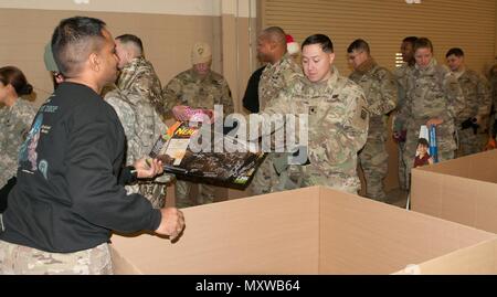 Soldiers stationed at Fort Bragg, N.C., donated toys for Operation Toy Drop on December 9 at Fort Bragg, N.C. During lottery day of OTD, Soldiers can choose to bring a toy to donate to local children in need. (US Army Reserve photo by Sgt. Darryl L. Montgomery, 319th Mobile Public Affairs Detachment) Stock Photo