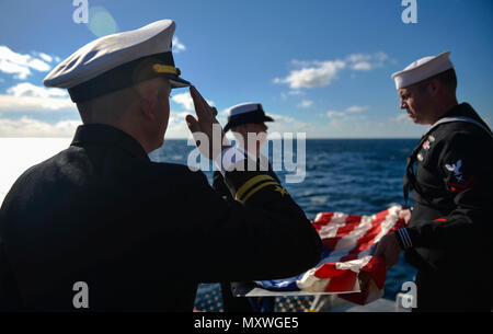 The rifle detail renders honors during a Burial at Sea ceremony held on ...