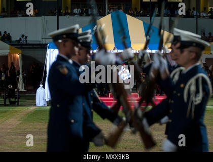 The U.S. Coast Guard Ceremonial Honor Guard perform Thursday, Dec. 1, 2016, for Britain's Prince Harry (background) and Barbados' Prime Minister Freundel Stuart during the 50th Anniversary of Emancipation celebrations at the Kensington Oval cricket ground in Bridgetown, Barbados. 20,000 people including Barbadian pop star Rihanna attended the celebration that marked 50 years of the island's independence from England. U.S. Coast Guard photo by Petty Officer 1st Class Mike De Nyse Stock Photo