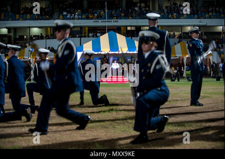 The U.S. Coast Guard Ceremonial Honor Guard perform Thursday, Dec. 1, 2016, for Britain's Prince Harry, seen in the background, and Barbados' Prime Minister Freundel Stuart during the 50th Anniversary of Emancipation celebrations at the Kensington Oval cricket ground in Bridgetown, Barbados. 20,000 people including Barbadian pop star Rihanna attended the celebration that marked 50 years of the island's independence from England. U.S. Coast Guard video by Petty Officer 1st Class Mike De Nyse Stock Photo