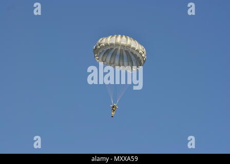 Maj. Gen. Daniel Ammerman, Commanding General of US Army Civil Affairs and Psychological Operations Command (Airborne), descend from an aircraft during an airborne operation for the 19th Annual Randy Oler Memorial Operation Toy Drop, hosted by U.S. Army Civil Affairs & Psychological Operations Command (Airborne), at Luzon Drop Zone, N.C., Dec. 10, 2016. Operation Toy Drop is the world’s largest annual joint combined airborne operation and collective training exercise with paratroopers from eight partner-nations participating. (U.S. Army Photo by Spc. Jesse L. Artis Jr./Released) Stock Photo