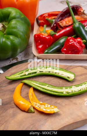Colorful fresh hot Mexican chili peppers in assortment Stock Photo