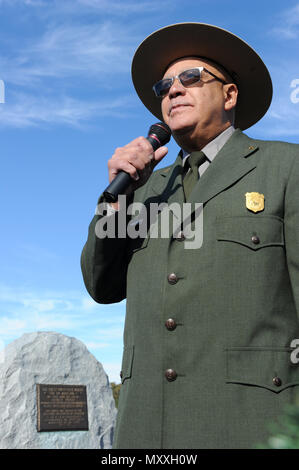 Darrell Collins, historian with the U.S. National Park Service, recounts the story of the first flight during the ceremony for the 113th Wright Brothers Anniversary of Powered Flight at the Wright Brothers National Memorial in Kill Devil Hills, North Carolina, Dec. 17, 2016. The ceremony also marked the 100th anniversary of Coast Guard aviation and the induction of the first two Coast Guard helicopter pilots into the Paul E. Garber First Flight Shrine. (U.S. Coast Guard Photo by Coast Guard Petty Officer 3rd Class Corinne Zilnicki/Released) Stock Photo