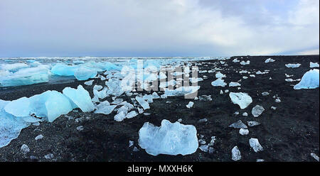 Black sand beach and blue icebergs on Diamond Beach in Southern Iceland Stock Photo