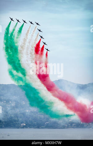 The Italian Aerobatic Display Team the Frecce Tricolori formation flying over the Lake Maggiore, Verbania, Italy Stock Photo