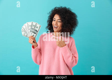 Successful american woman holding fan of money dollar bills and showing ok  sign isolated over white background Stock Photo - Alamy