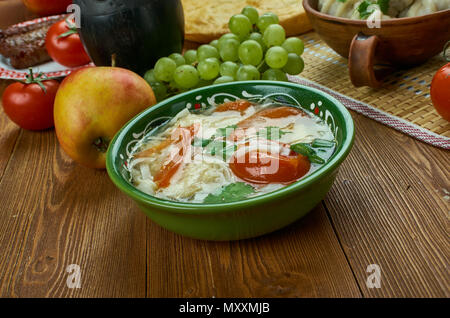 shorba Fish ogurdzhalinskaya,  Turkmen cuisine , Traditional assorted dishes, Top view. Stock Photo