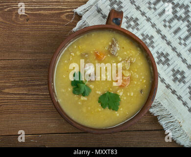 German Split Pea Soup,  ham hock, beef broth, split peas, and carrots. Stock Photo