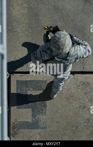 Personnel from the 633rd Security Forces Squadron present a ceremonial ...
