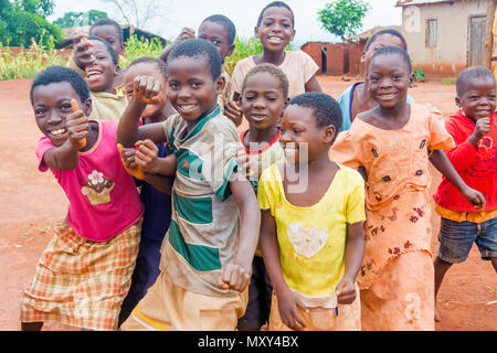 Dzoole, Malawi - March 30, 2015: Group of young children playing at the road in small village of Dzoole in Malawi. Stock Photo