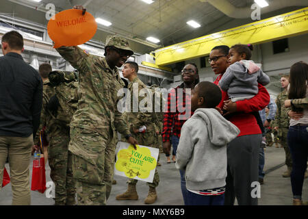 A Soldier of 6th Squadron, 8th Cavalry Regiment, 2nd Infantry Brigade Combat Team, 3rd Infantry Division reunites with loved ones at Fort Stewart, Georgia, December 13, 2016. Troopers of 6-8 Cav. returned from a five-month rotation supporting Joint Multinational Training Group-Ukraine, building sustainable training capacity and capability within Ukrainian land forces. (U.S. Army photo by Staff Sgt. Candace Mundt/Released)