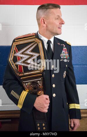 Army Maj. Gen. Bradley Becker, commanding general, U.S. Army Military District Washington, carries his WWE Championship belt during the 14th Annual Tribute to the Troops Event at the Verizon Center in Washington, D.C., Dec. 13, 2016. WWE Tribute to the Troops is an annual event held by WWE and Armed Forces Entertainment in December during the holiday season since 2003, to honor and entertain United States Armed Forces members. WWE performers and employees travel to military camps, bases and hospitals, including the Walter Reed Army Medical Center and Bethesda Naval Hospital. DoD Photo by Navy  Stock Photo