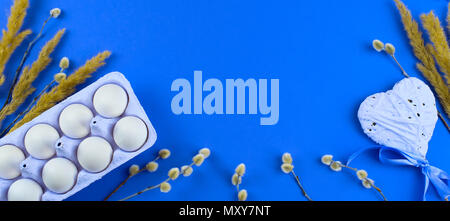 Banner Easter set gift box with branches catkins White egg. The view from the top Place for text. Background ultraviolet Stock Photo
