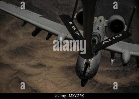 A U.S. Air Force KC-135 Stratotanker assigned to the 340 Expeditionary Air Refueling Squadron refuels an A-10 Thunderbolt II over Afghanistan, May 28, 2018. The 340th EARS supports various operations in countries such as Iraq, Syria and Afghanistan. (U.S. Air Force Photo by Staff Sgt. Corey Hook) Stock Photo