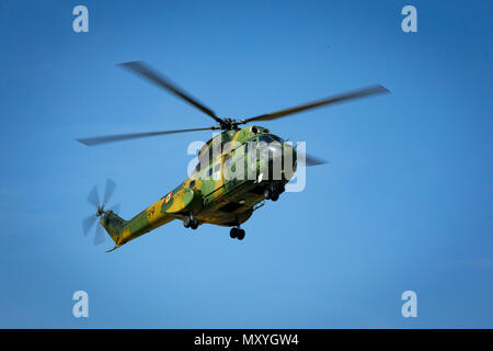 A Romanian IAR 330 Puma helicopter conducts notional Close Air Support (CAS) with U.S. Marines of Black Sea Rotational Force (BSRF) 18.1 aboard Mihail Kogalniceanu Air Base, Romania, May 15th, 2018. BSRF Marines maintain relationships with our allies and partner nations through a variety of training events, to include CAS coordination. (U.S. Marine Corps photo by LCpl. Angel D. Travis) Stock Photo