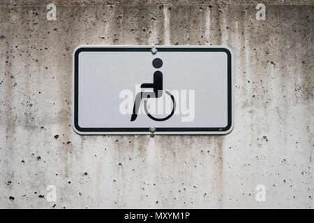 wheelchair symbol on sign -  handicapped parking spot  - Stock Photo