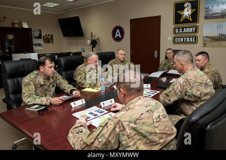 Brig. Gen. Richard Sele, the deputy commanding general of U.S. Army Civil Affairs & Psychological Operations Command (Airborne) from Fort Bragg, N.C., meets with Maj. Gen. William Hickman, U.S. Army Central deputy commanding general - operations, and other senior leaders during his visit to Camp Arifjan, Kuwait on Dec. 16, 2016. Sele's also visit also included a luncheon with civil affairs Soldiers where he addressed their comments and concerns and discussed missions operating throughout the region. (U.S. Army photo by Sgt. Angela Lorden) Stock Photo