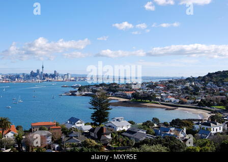 Landscape photograph of Auckland Harbour from Devonport, North Shore, looking out over the water to the sky tower in Auckland city, New Zealand Stock Photo