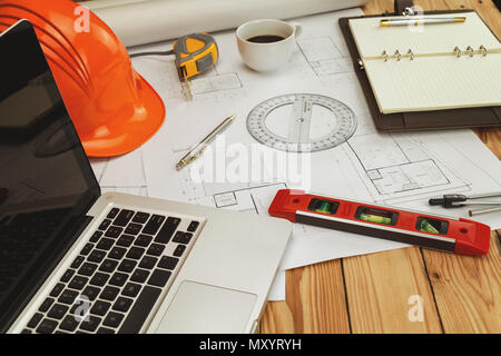 Helmet and architectural equipment. on blueprint, architectural concept Stock Photo