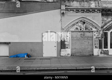 Homeless man sleeping rough, Hastings, East Sussex, England, UK Stock Photo
