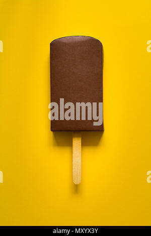 Woman holding delicious chocolate covered ice cream on stick against ...