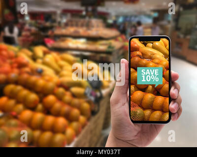 Family in the supermarket use Application of Augmented Reality Supermarket for Discounted or on Sale Stock Photo