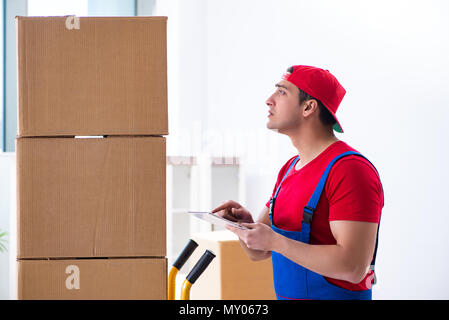 Contractor worker moving boxes during office move Stock Photo