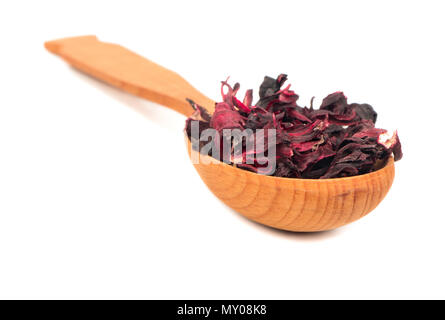 Wooden spoon with dry leaves hibiscus tea on white background Stock Photo