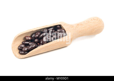 Sunflower seeds chocolate and wooden scoop on white background Stock Photo