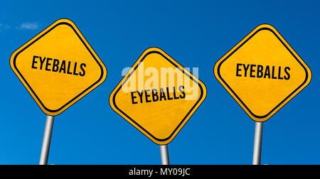 Eyeballs - yellow signs with blue sky Stock Photo