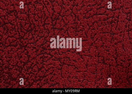 Relief textile background in admirable red colour. Stock Photo