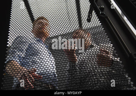 Appealing two colleagues talking about server closet Stock Photo