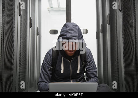 Angry male hacker breaking into system Stock Photo
