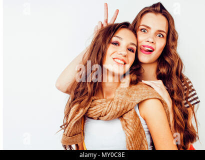 Two female friends at lakeside posing for smartphone selfie stock photo