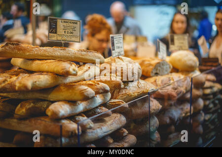 London, UK - November 2017. French baguettes on sale in a bakery stall in Borough Market, one of the oldest and largest food markets in London. Stock Photo