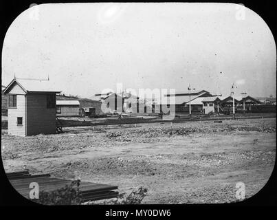 Roma Street railway station, Brisbane. Opening Of The Railway.  The first train carrying passengers from the Brisbane terminus started at half-past 6 o'clock yesterday morning, and, in spite of the earliness of the hour, a number of persons had assembled on the platform to witness this historical event. The utmost exertions of a large body of men had only sufficed to make the line fit for travelling, without being able to make a really finished job of it, the ballasting being only laid under the sleepers at considerable distances. The motion was, consequently, greater than will hereafter be th Stock Photo