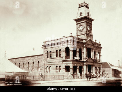 Warwick Town Hall, 1897. From the Queensland Heritage Registerid=600961 ) .  Officially opened in October 1888, this sandstone building survives as evidence of the consolidation of Warwick as a business and administrative centre for the surrounding district during the late nineteenth century.  Warwick township developed slowly during the 1850s and by 1857 the population of the parish of Warwick had reached just over 1 300. Under the provisions of the 1858 Municipalities Act (NSW), any centre with a population in excess of 1000 was entitled to petition the colonial government for recognition as Stock Photo