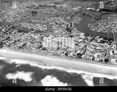 Aerial view of Surfers Paradise, March 1973. Gold Coast Bulletin 25 April 1973  $32m SCHEME FOR HEART OF SURFERS  company applied to the Gold Coast City Council for permission to go ahead with a $32 million redevelopment plan for the heart of Surfers Paradise.  The project featured a giant complex featuring a circular 33-storey tower block as the centrepiece of an international hotel.  Other features included a major convention centre, department store, supermarket, specialty stores, bus terminal, cinema, offices, a new surf club, sports facilities and landscaped public areas.  It also provide Stock Photo