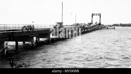 Jubilee Bridge, Southport, c 1932. The Brisbane Courier 15 March 1932  JUBILEE BRIDGE, SOUTHPORT. 21790083 )   After being out of commission for the last fortnight owing to a break In the main gear-wheel the lift span of the Jubilee Bridge has been repaired and the fiver is now open to navigation The Mayor of Southport (Alderman C II Steadman) stated yesterday that satisfactory repairs had been made the wheel had been welded and wrought Iron bands had been shrunk on the boss. Stock Photo