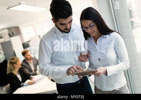 Young attractive architects using digital tablet in office Stock Photo
