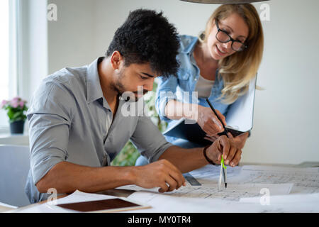 Coworkers working at business office and using tablet Stock Photo