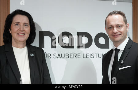 Berlin, Germany. 05th June, 2018. The chairwoman and the chairman of the German National Anti-Doping Agency (NADA), Andrea Gotzmann (L) and Lars Mortsiefer, stand next to the logo during their financial statement press conference. The Olympic and Paralympic Games in Pyeongchang, the advancement of the dopic control system and the expansion of the prevention measures were important cornerstones of NADA's work in 2017. Photo: Jörg Carstensen/dpa Credit: dpa picture alliance/Alamy Live News Stock Photo