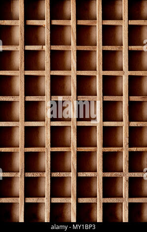 wooden box with many empty compartments Stock Photo