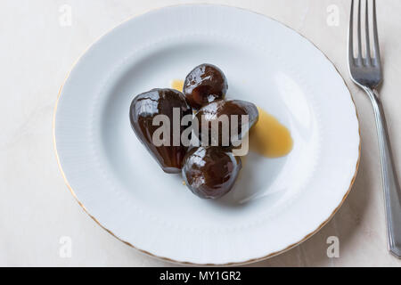 Turkish Style Crispy Fig Dessert served with Plate and Fork / Fruit Jam Dessert. Organic Food Stock Photo